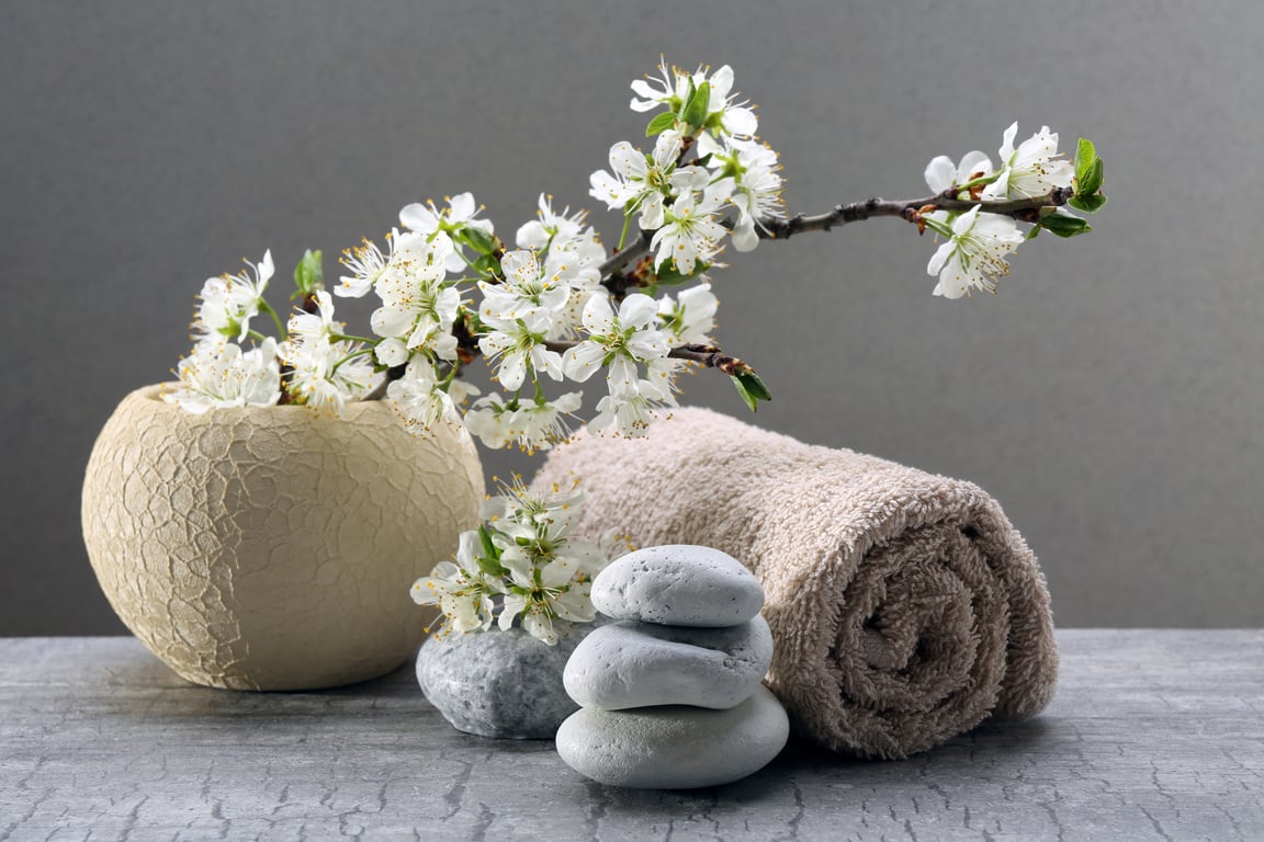 Hot Stones, Towel, and Flowers for Spa Treatment 